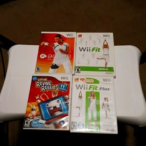 Wii 3 workout games, 1 game that uses the balance board, and balancing board.